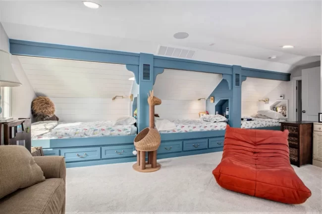 Custom Built-In Bunk Beds with Blue Trim | Pennings & Sons Custom built-in bunk beds with blue trim, white shiplap walls, and cozy children’s sleeping spaces