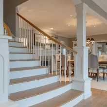 Formal Staircase with Floor to Ceiling White Pillars