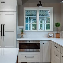 White Kitchen With Cabinet looking fridge doors