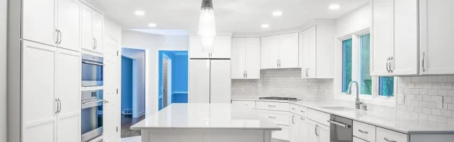 Kitchen Remodel with Island | Pennings & Sons Kitchen with all white cabinets and island in the middle with matching brick shaped backsplash and flooring