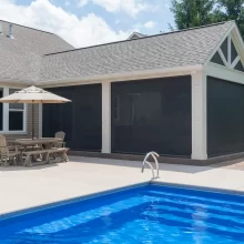 Side view of the covered patio expansion with pool with the screens closed